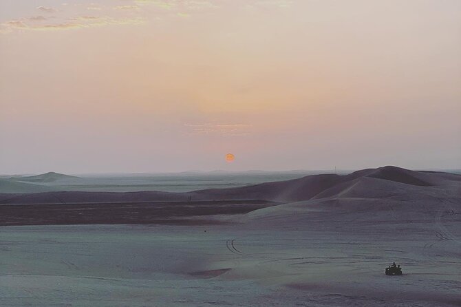 4 Hour Desert Safari, Camel Ride & Inland Sea Beach - Sandboarding on broad desert slopes