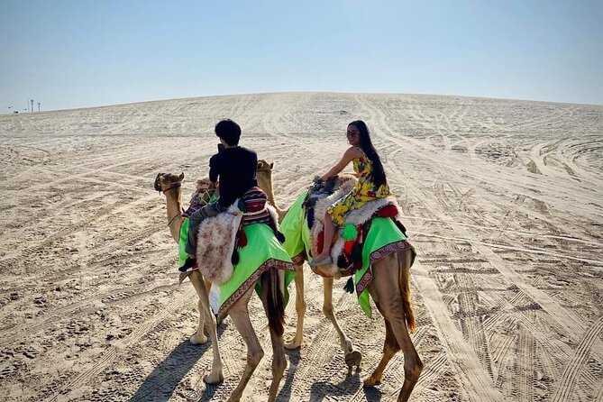 Camel trekking on the Dunes with Sunset - Reaching Sealine Beach from Doha