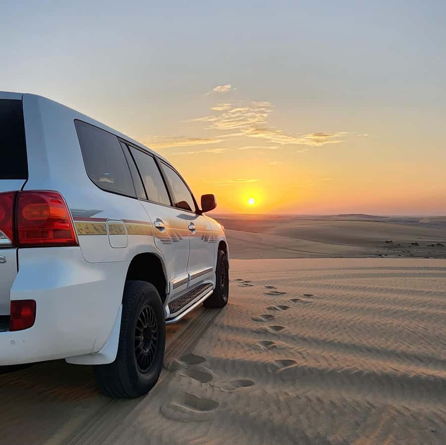 Doha: Desert Safari, Adventure, Sandboarding and Camel Ride - Sandboarding on the soft dunes