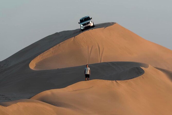 Doha: Desert Safari | Camel ride | Sand-boarding | Quad Biking - Sandboarding: simple, sandy, and surprisingly fun