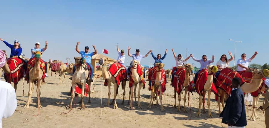 DOHA: Desert safari +Dune Bashing, Camel ride & Quad bikes - Arabic tea, camels, and a falcon photo