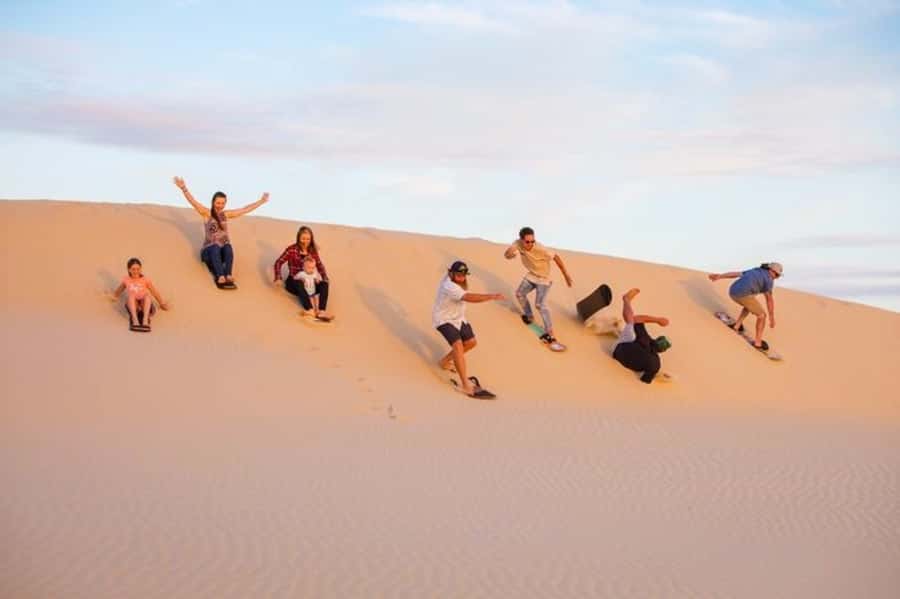 Doha: Desert Safari Dune Bashing, Sandboarding, & Camel Ride - Leaving Doha for Mesaieed and the southern desert