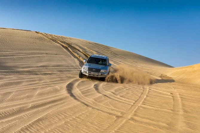 Doha Desert Safari: Dunebashing, Camel, Sandboarding & Inland Sea - The guides shape the whole day
