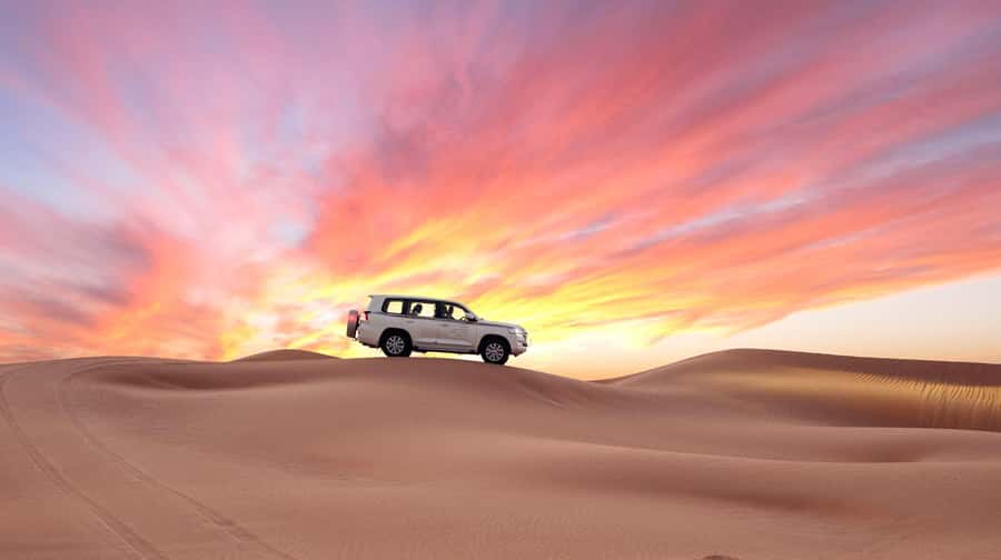 Doha: Desert Safari, Sandboarding, Dune Bashing & Inland Sea - Dune bashing in a Land Cruiser or SUV