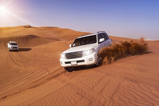 Doha: Desert Safari With Quad bike ,Camel Ride And Sand Boarding - Sealine Beach: a short pause with tea and camels