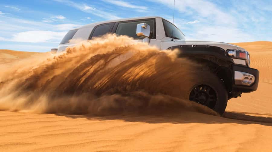 Doha: DesertSafari with Quad Bike, Camel Ride & Sandboarding - Sandboarding on soft golden slopes