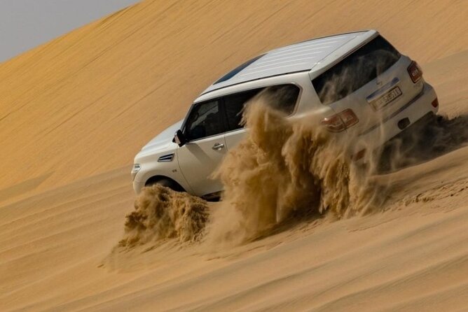 Doha Half Day Desert Safari Dune Bashing Camel Ride Sandboarding - Camel riding, tea, and the Bedouin-style stop