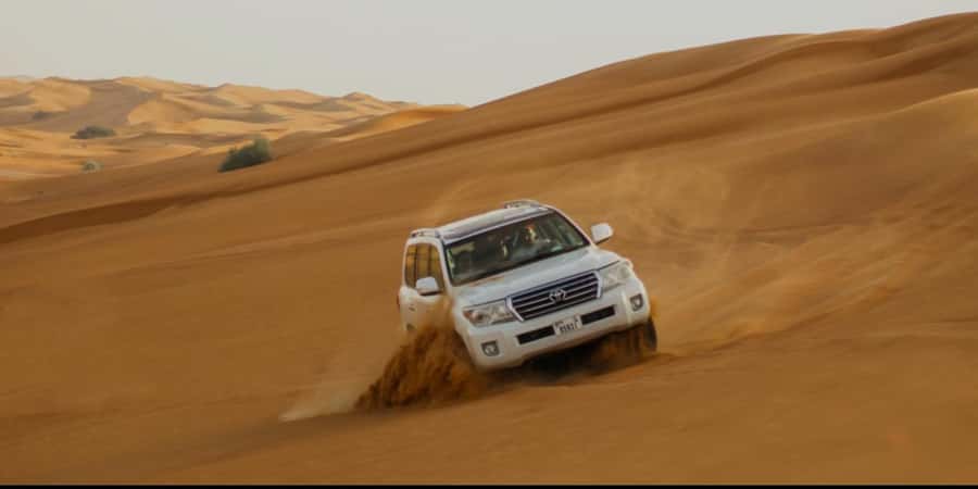 Doha: Half Day Desert Safari With Camel Ride & Sand Boarding - Leaving Doha in an air-conditioned 4WD