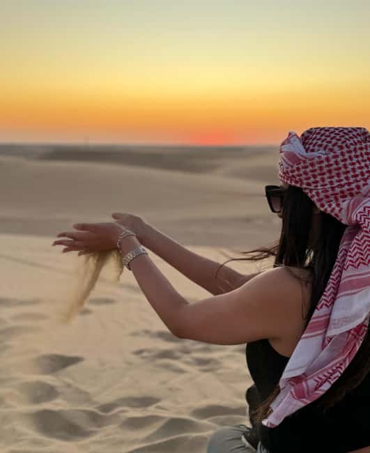 Doha Qatar : sealine adventure Camel Ride sandboard Sunset - The camel stop and optional falcon photo