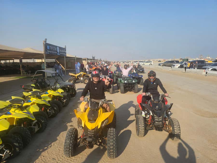 Doha: Quad Bike, Desert Safari, Buggy ride & inland sea tour - A short camel ride and falcon photo stop