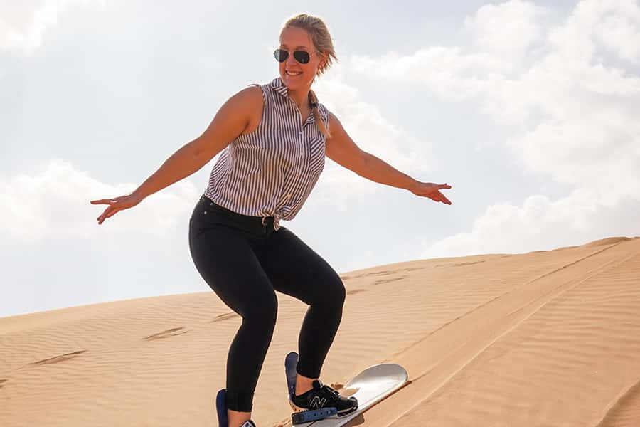Doha: Safari, ATV, Camels, Sandboarding and Inland Sea Tour - Dune bashing across Qatar’s golden dunes