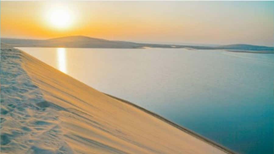 Doha :Sunrise/ Sunset Desert Safari CamelRide & Sandboarding - Sunset over the Inland Sea