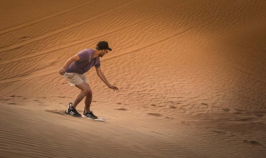 Doha: Sunset Desert Safari, ATV, Camel Ride and Sandboarding - Sandboarding: fun on the way down