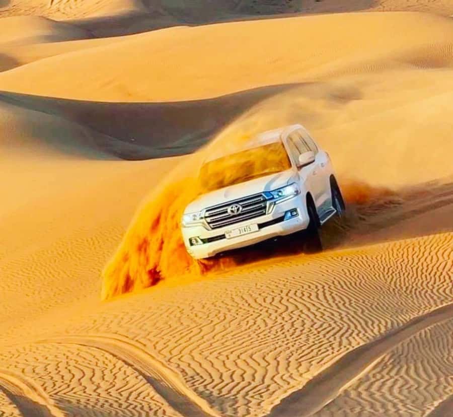 Doha: Sunset Desert Safari with Camel Ride & Sandboarding - A short camel ride with Bedouin context