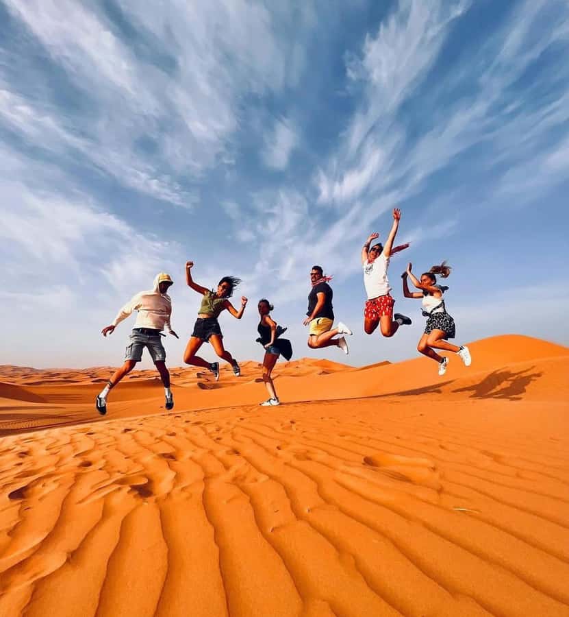 Doha: Sunset Desert Safari with Camel Ride & Sandboarding - Booking, pickup, and the return to Doha