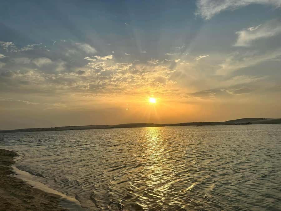 Doha: Sunset desert tour with Camel Ride, Inland Sea & Tea - A short camel ride in Mesaieed