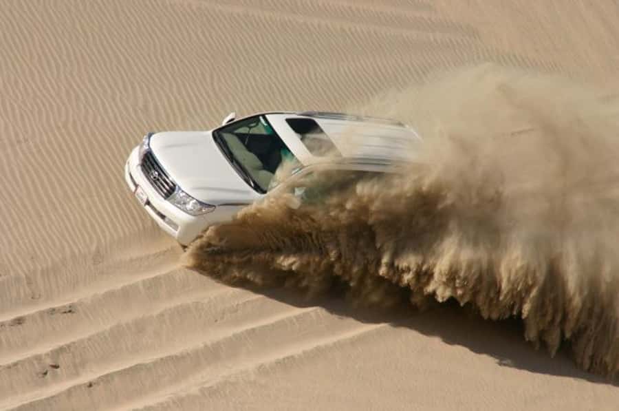 Dune Bashing, Sandboarding, Camel Ride & Optional ATV Ride - The final dune run and return to Doha