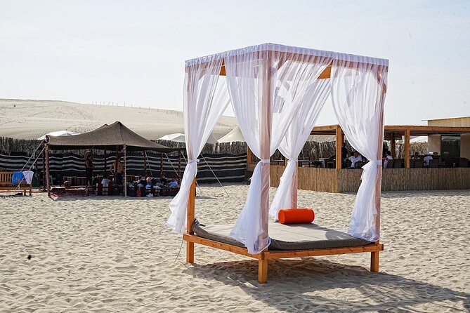 Private Full Day Desert Safari Dinner and Camel Ride in Doha - Sandboarding for a closer look at the dunes