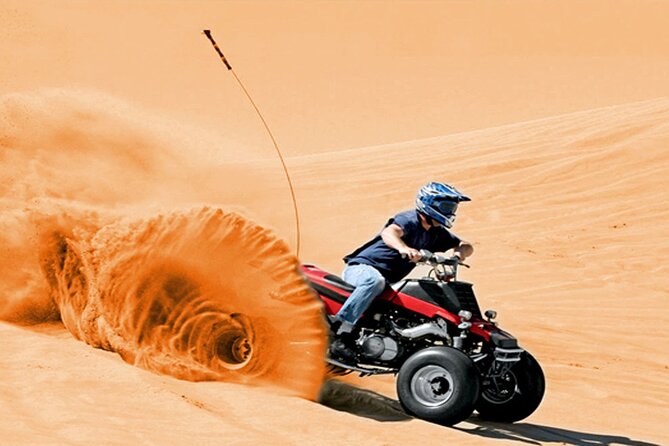 Qatar ATV And Quad Bike Experience With Sand Boarding - Riding red sand on a designated track