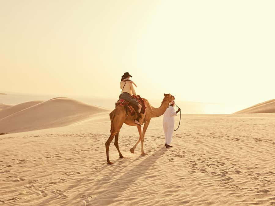 Qatar Desert Safari, Quad bike, Camel Ride and Sandboarding - Sandboarding and photos at Qatar’s Inland Sea