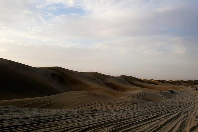 Qatar Sunset Desert Safari: Dune Bashing & Golden Sands Adventure - Sunset beside the Inland Sea