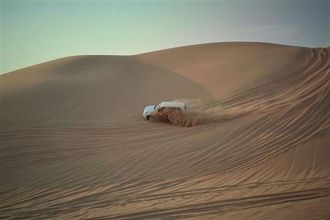 Qatar Sunset Desert Safari: Dune Bashing & Golden Sands Adventure - Two hours of dune bashing in a 4WD