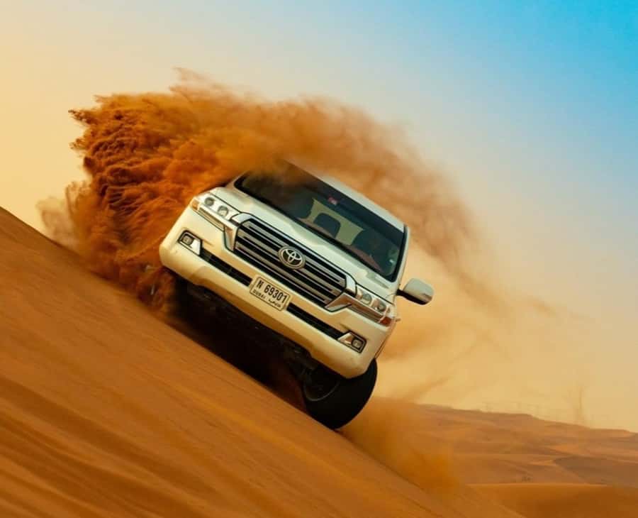 Qatar: Sunset Desert Safari with Camel Ride & Sandboarding - The return to Doha and drop-off choices
